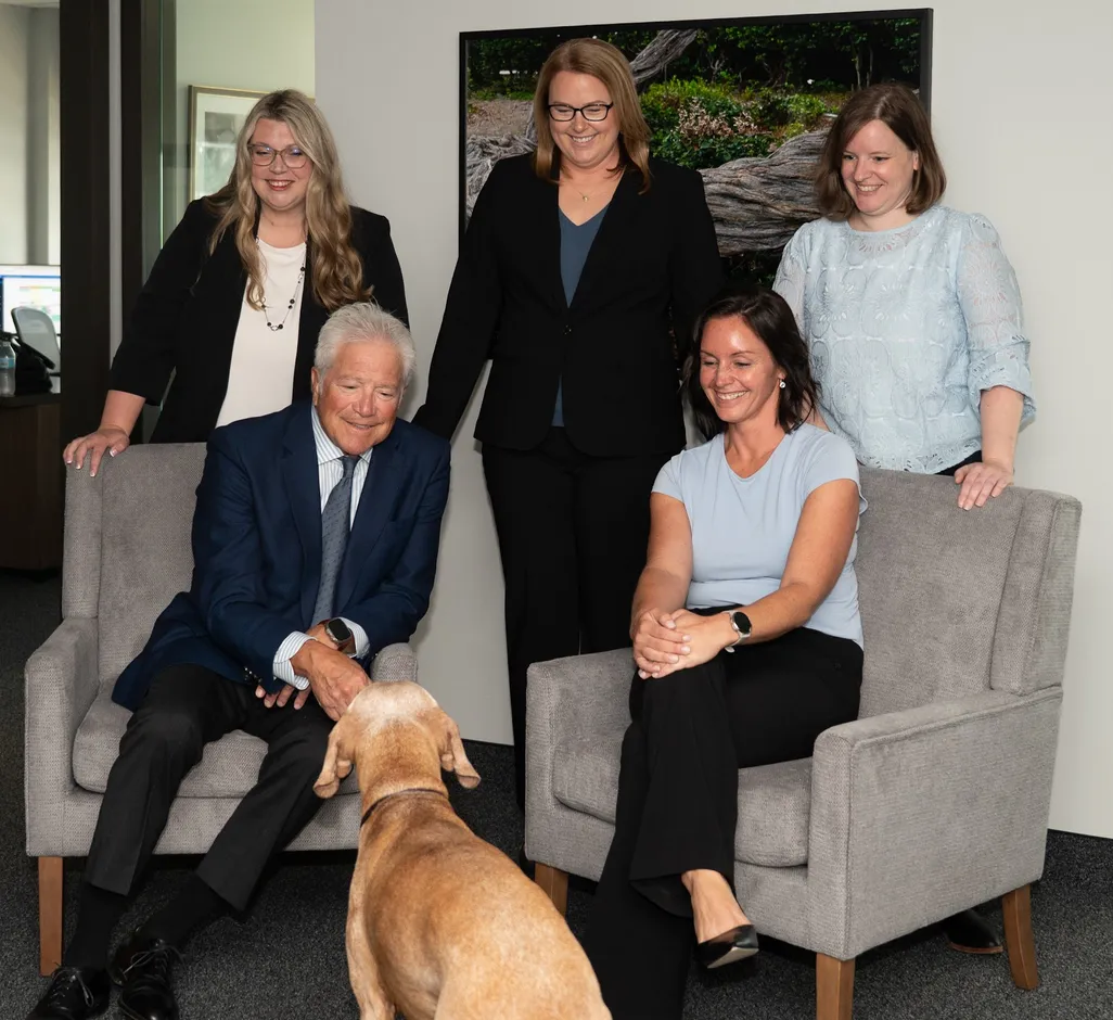 Schefman & Associates attorneys and staff with the office dog